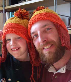 A man walkes down the street in a hat like that...