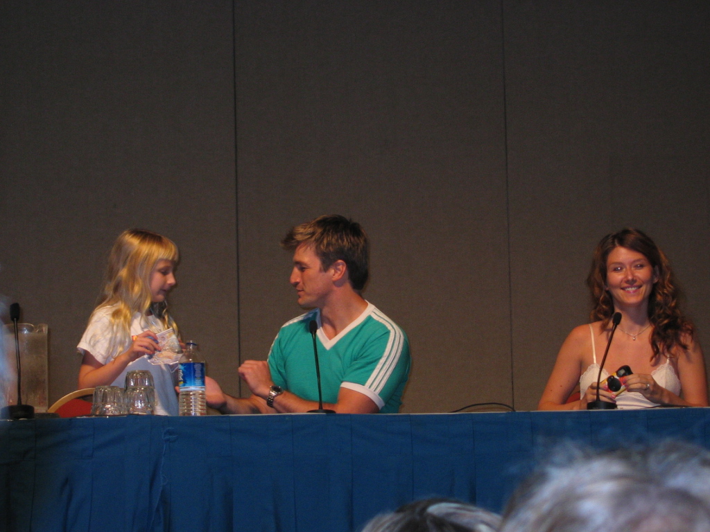 Nathan giving fan Alliance money at Dragon*Con